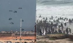 Gazzeliler denize düşen yardımları alırken boğulma riski altında
